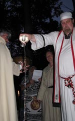 Rev. Ian Corrigan pours the Waters of Blessing for the Groves and Solitaries of ADF
